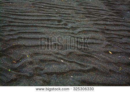 Pacific Ocean Beach With Dark Sand In Cloudy Weather