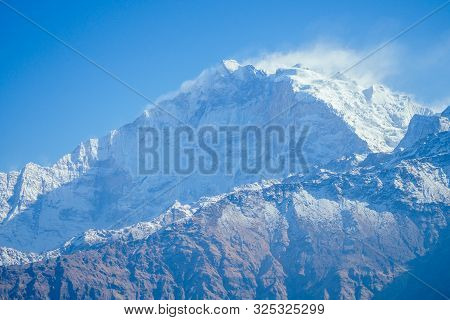 Beautiful View Of The Landscape Of The Himalayan Mountains. Snow-covered Mountain Peaks. Trekking Co
