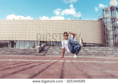 Male Athlete, Guy Dancer Summer City. Free Space For Motivation Text. Fashionable And Modern Break D