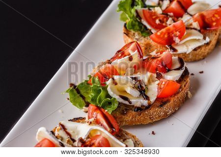 Bruschetta With Tomatoes, Lettuce, Camambert, Balsamic Vinegar