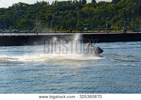 Aqua Sport On A Jet Ski, An Athlete Performs Various Exercises On The Water.