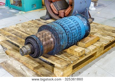 Powerful Disassembled Electric Motor, Rotor And Stator On The Repair Rack.