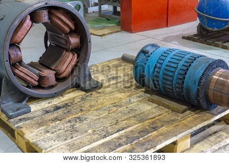 Powerful Disassembled Electric Motor, Rotor And Stator On The Repair Rack.