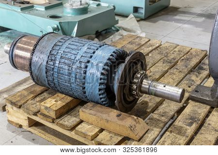 Powerful Disassembled Electric Motor, Rotor And Stator On The Repair Rack.