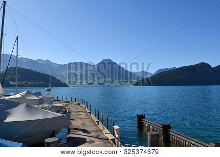 Vitznau, Switzerland 29.09.2019: Landscape View From The Port Of Lake Lucerne With The Majestic Moun