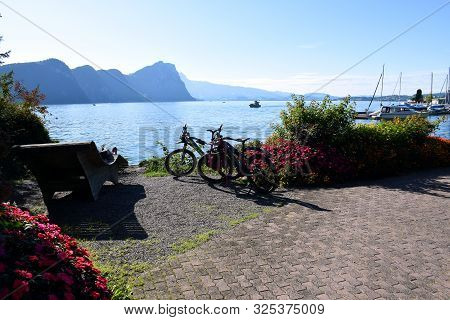 Vitznau, Switzerland 29.09.2019: Mountain Bikes On The Shores Of Lake Lucerne Surrounded By Beautifu