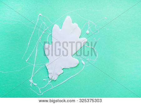 Neo Mint Color Trendy Background With White Oak Leaf And Copyspace. Hello Autumn Concept.