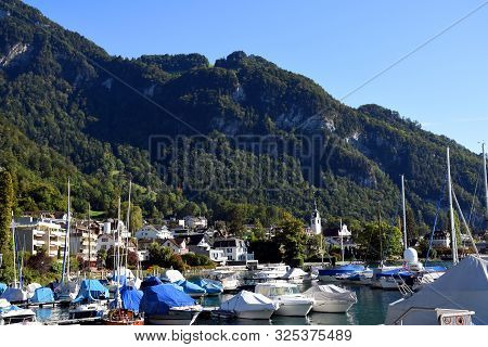 Vitznau, Switzerland 29.09.2019: Sailing Boats Resting In The Port Of Vitznau On Lake Lucerne With V