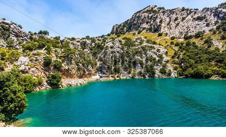 Water Dam At Embassament De Cuber, It Is An Artificial Lake, Water Reservoir, Located At The Valleys