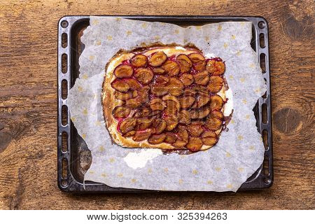 Overview Of Bavarian Plum Pie On Dark Wood