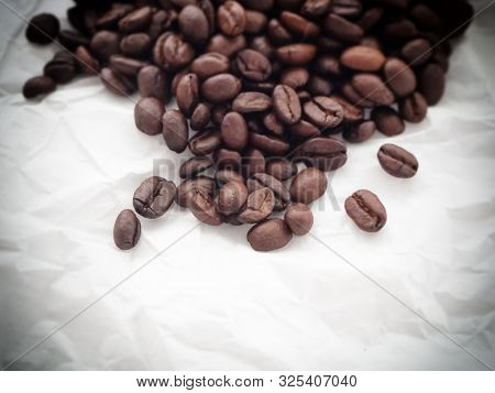 Group Of Coffee Bean Put On Grunge Surfae Background