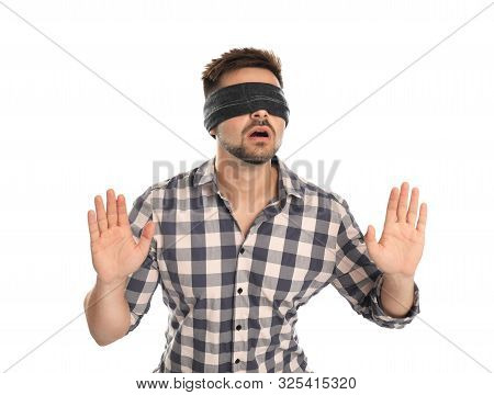 Young Man With Black Blindfold On White Background