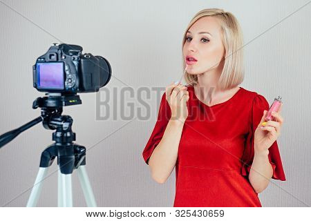 Attractive Blond Videoblogger Beauty Blogger Woman In A Red Dress Records Video Blog About The Care 