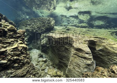 Rocks Underwater On Riverbed With Clear Freshwater. Underwater Landscape. Traun River. Freshwater Wo