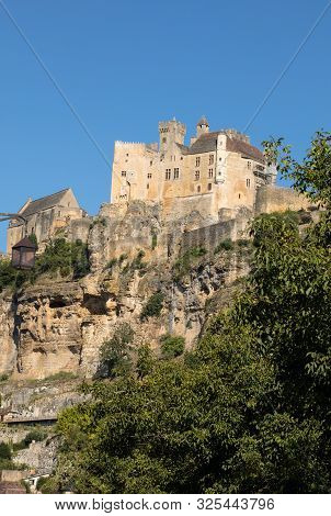 The Medieval Chateau De Beynac Rising On A Limestone Cliff Above The Dordogne River. France, Dordogn