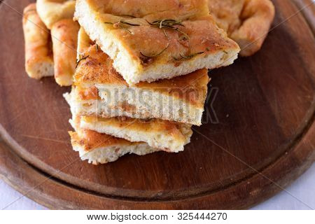 Homemade Italian Focaccia Modenese, With Rosemary And Olive Oil/ Freshly Baked And Ready To Eat