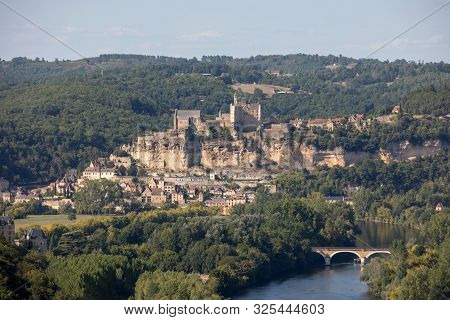 The Medieval Chateau De Beynac Rising On A Limestone Cliff Above The Dordogne River Seen From Castel