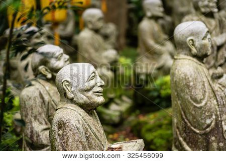 groups of buddhist arhat stone statue in the garden