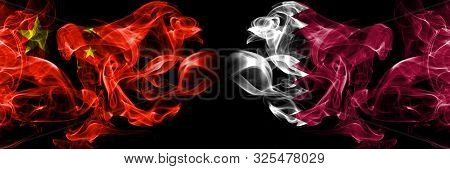 China Vs Qatar, Qatari Smoke Flags Placed Side By Side. Thick Colored Silky Smoke Flags Of Chinese A