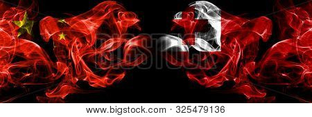 China Vs Tonga, Tongan Smoke Flags Placed Side By Side. Thick Colored Silky Smoke Flags Of Chinese A