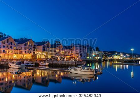Molde, Norway - Aug 22, 2019: Night View In Architecture And Building Of The Norwegian City. Wooden 
