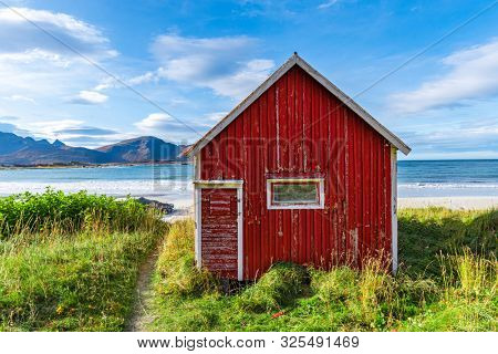 Red Rorbu at Ramberg Beach in Lofoten Islands, Norway