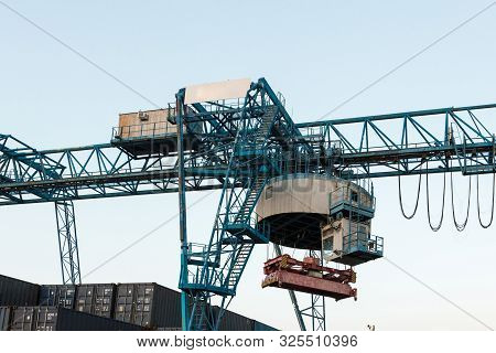 Large Industrial Port Crane Unloads Cargo Containers