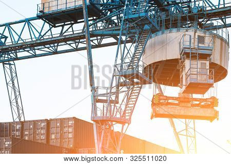 Large Industrial Port Crane Unloads Cargo Containers
