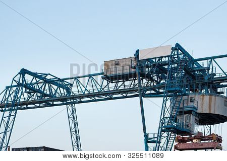Large Industrial Port Crane Unloads Cargo Containers