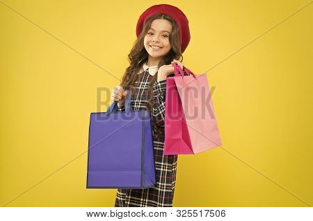 Big Sales. Happy Girl With Long Curly Hair In Beret. Shopping. Child With Shopping Bag. Parisian Chi