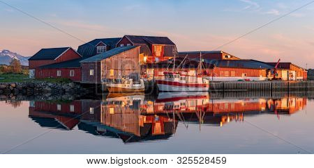 Laukvik Village on the Lofoten Islands,  Norway. The Typical Norwegian fishing village at midnight sun,  with the typical rorbu houses.  