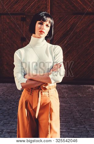 High Waisted Trousers Keep Returning To Catwalk. Fashion Girl. Femininity And Emphasize Feminine Fig