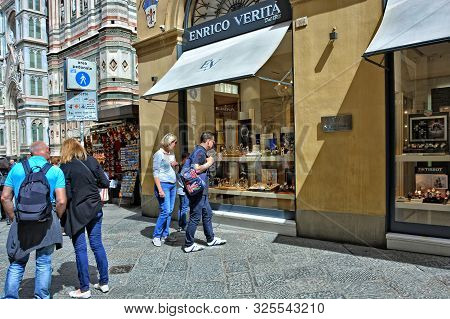 Shopping In Italy. Tourists Look At A Storefront Of Enrico Verita Store In Florence. Jewelry. Exclus