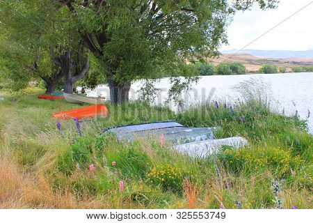 Boats on the bank of lake alexandrina in new zealand