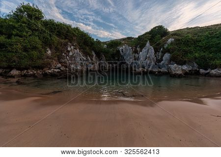 Secret And Hidden Gulpiyuri Beach In Llanes Asturias