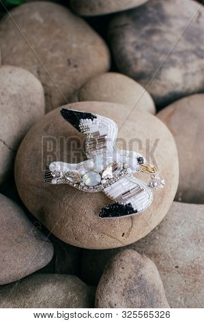 Beautiful stud earrings on the stone. Stock photo