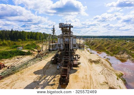 Old Rusty Multi Bucket Excavator, Giant Stacker, Absetzer In Sandy Career.
