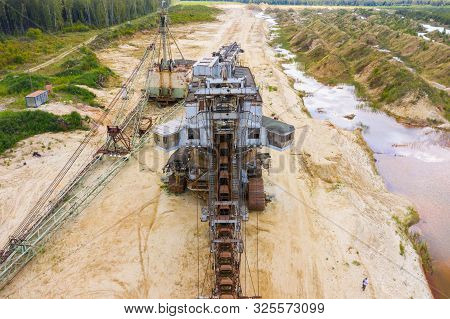 Old Rusty Multi Bucket Excavator, Giant Stacker, Absetzer In Sandy Career.