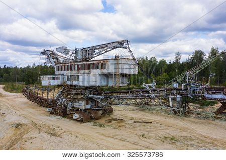 Old Rusty Multi Bucket Excavator, Giant Stacker, Absetzer In Sandy Career.
