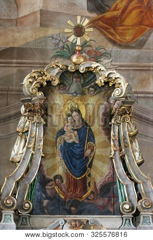 SAMOBOR, CROATIA - MARCH 03, 2018: Virgin Mary with baby Jesus, main altar in the Church of the Assumption of the Virgin Mary in Samobor, Croatia