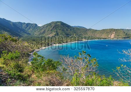 Beautiful landscape of Senggigi beach, Lombok island, scenic travel destination beach with crystal blue waters, Indonesia