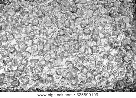 A Photograph Of A Layer Of Ice Cubes Backlit