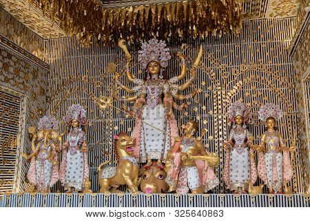 Goddess Durga Idol At Decorated Durga Puja Pandal, Shot At Colored Light, At Kolkata, West Bengal, I