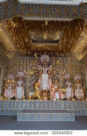 Goddess Durga Idol At Decorated Durga Puja Pandal, Shot At Colored Light, At Kolkata, West Bengal, I