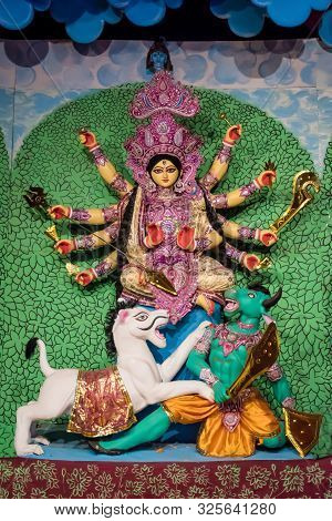 Goddess Durga Idol At Decorated Durga Puja Pandal, Shot At Colored Light, At Kolkata, West Bengal, I