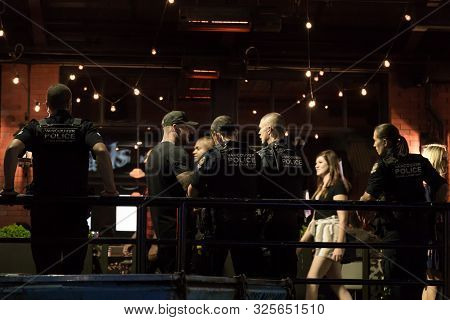 Vancouver, Bc, Canada - Sept 7, 2019: The Vancouver Police Gang Unit Questioning A Member Of The Pub