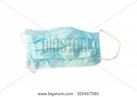 Surgical Ear-loop Mask On White Background. Medical Disposable Face Mask