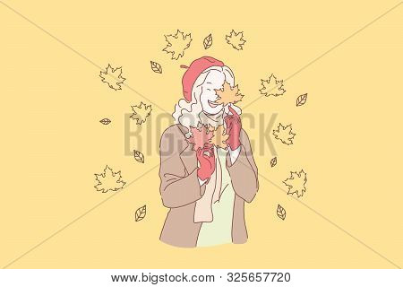 Enjoying Autumn Weather Concept. Young Blonde Girl Holding Yellow Leaves Bunch, Elegant Lady In Red 
