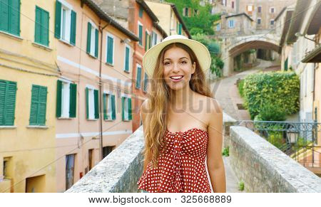 Portrait Of Young Attractive Cheerful Woman Walking In Old Italian City.