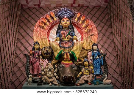 Goddess Durga Idol At Decorated Durga Puja Pandal, Shot At Colored Light, At Kolkata, West Bengal, I
